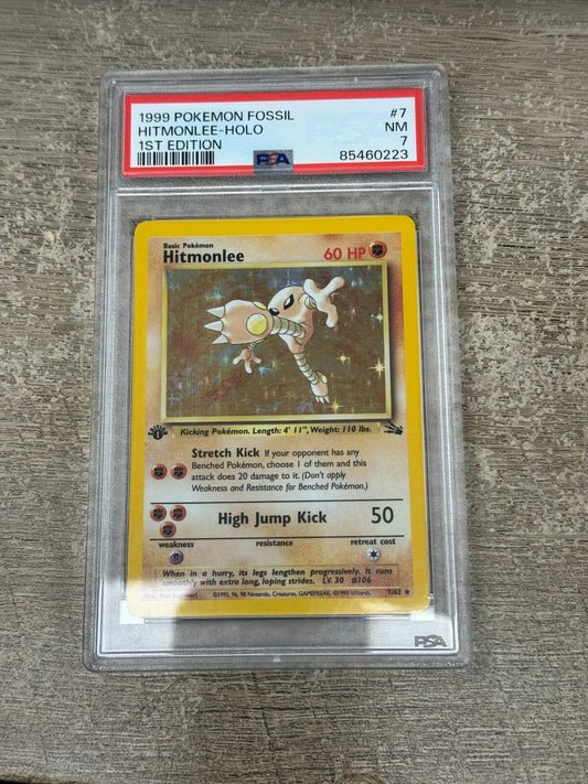 POKEMON FOSSIL 1ST EDITION HITMONLEE HOLO 7/62 PSA 7 NRMT PK207