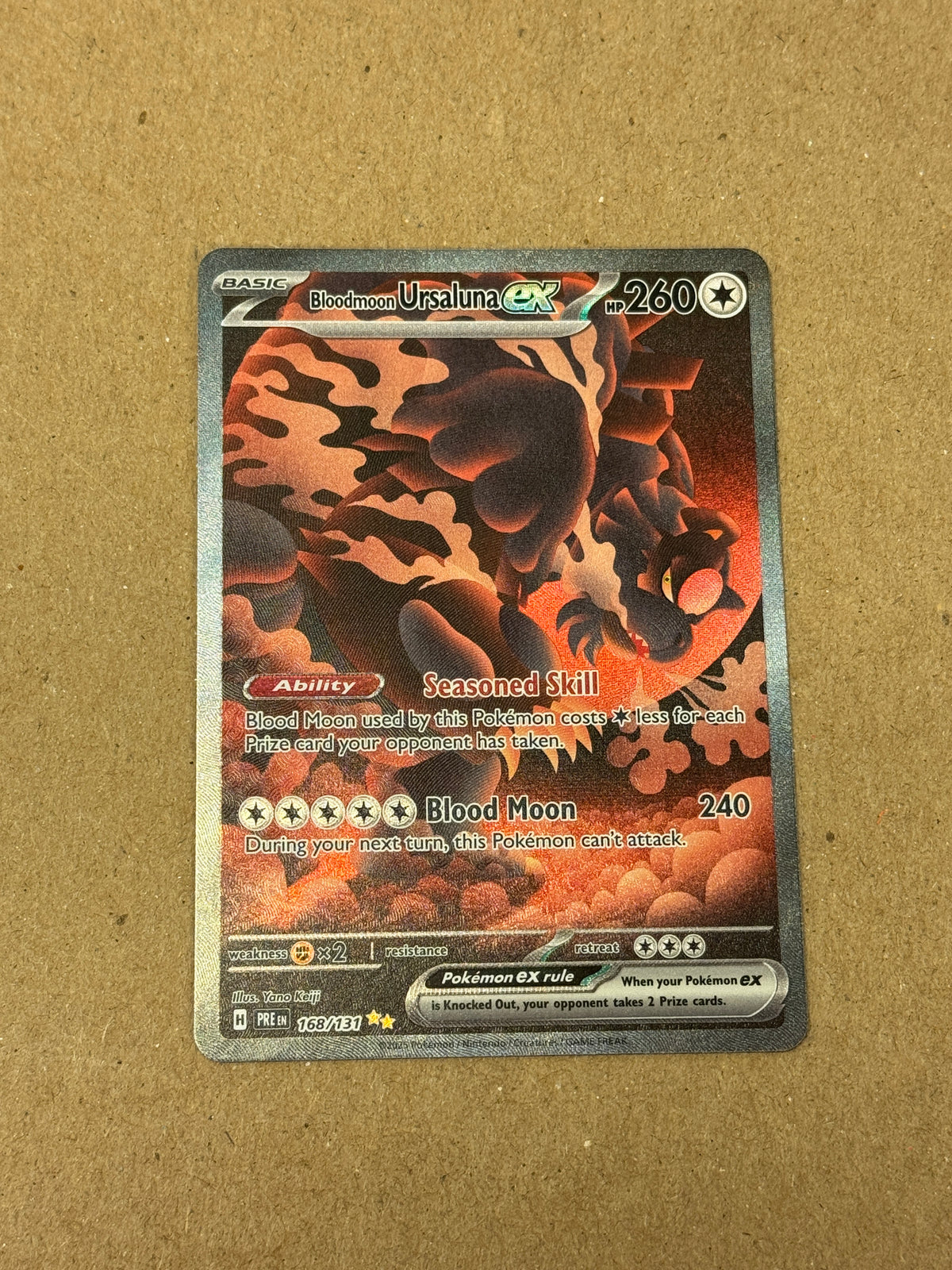 PRISMATIC EVOLUTIONS BLOODMOON URSALUNA ex 168/131  RAW  PK1449